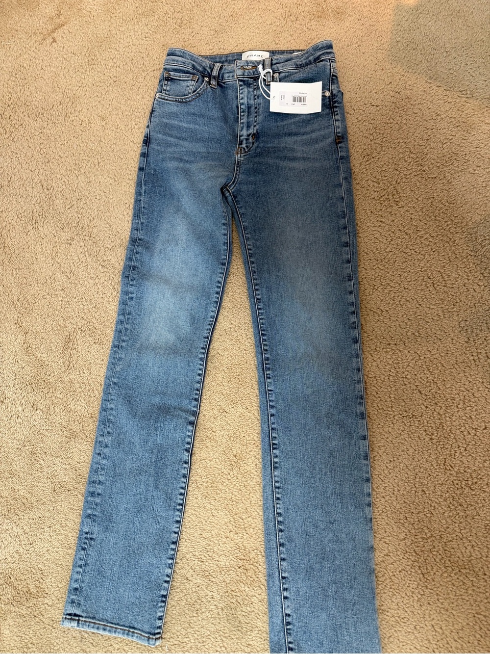 Frame Light Wash High-Rise Skinny Jeans